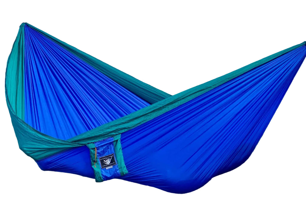 Parachute Silk Travel Hammock • Double 6.5’x10’ • 440 lb Rated • Includes 24 kN Carabiners & Stuff Sack • Ultralight & Breathable • Handcrafted in Bali Since 1996