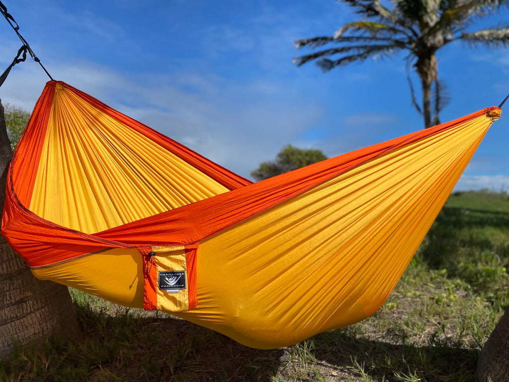Parachute Silk Camping Hammock • Puka’ana/Sunset • Double XXL 6.5’x10’ • 440 lb Rated • Includes Carabiners & Stuff Sack • Ultralight & Packable • Handcrafted in Bali Since 1996